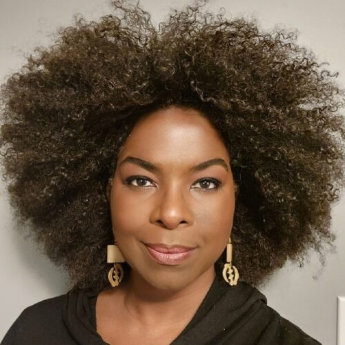 A headshot photo of board member Beatrice Hector